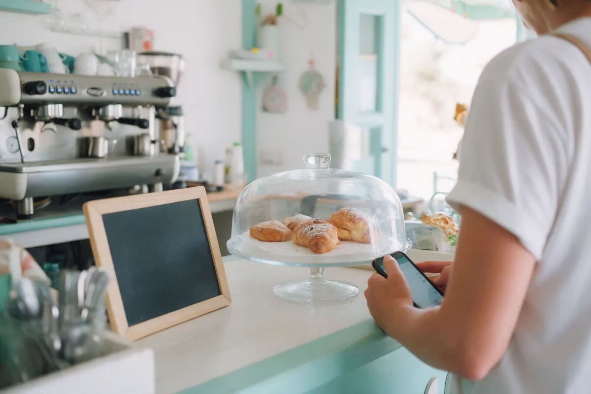 Behind the counter of a small café.
