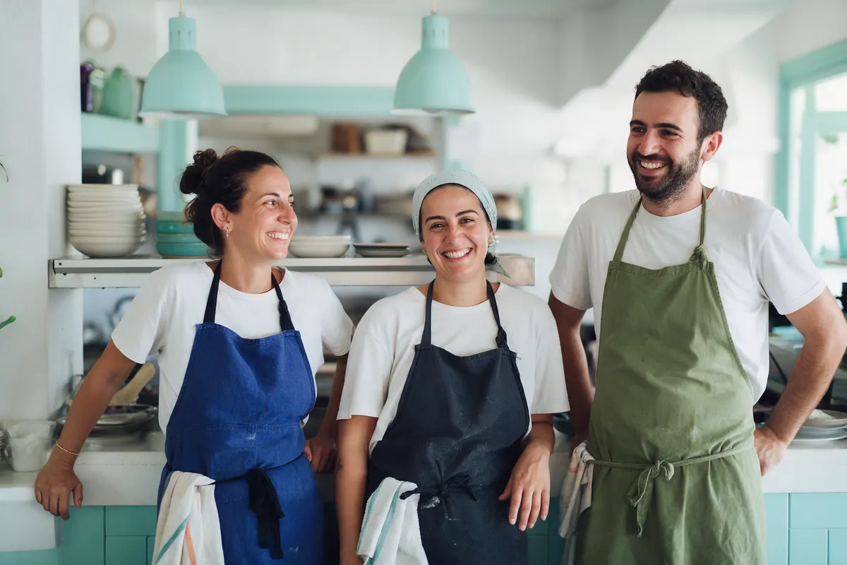 A small restaurant team in their kitchen.